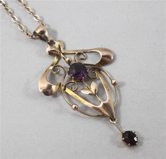 An Art Nouveau 9ct gold and amethyst set pendant necklace, pendant 40mm.